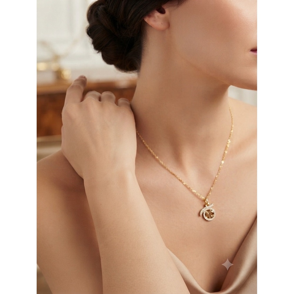 Nina Ricci Gold Tone NR Logo Bow Rhinestone Figaro Chain Necklace Vintage Style